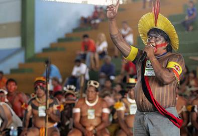A member of one of Brazil's indigenous tribes protests against a proposed hydroelectric dam on the n